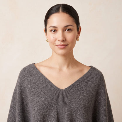 Women's undyed cashmere poncho in Mid Grey Melange — worn by a model