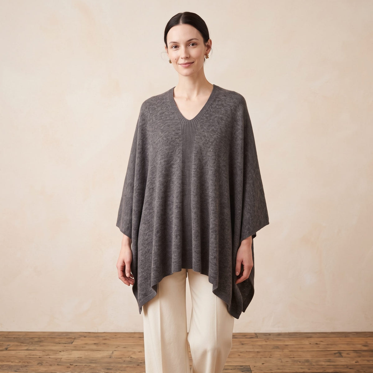 Women's undyed cashmere poncho in Mid Grey Melange — worn by a model (2)