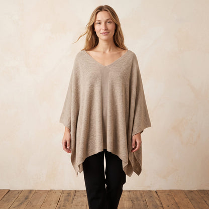 Women's undyed cashmere poncho in Oatmeal Melange — worn by a model (2)