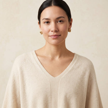 Women's V-neck cashmere poncho in Off-White — worn by a model