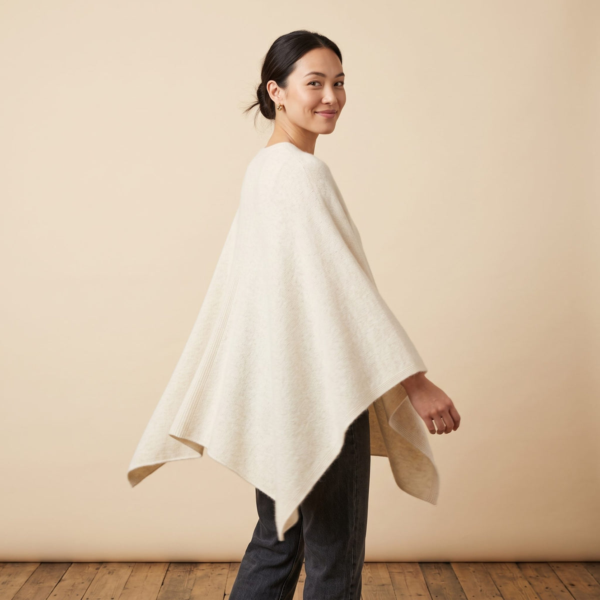 Women's V-neck cashmere poncho in Off-White — worn by a model (3)