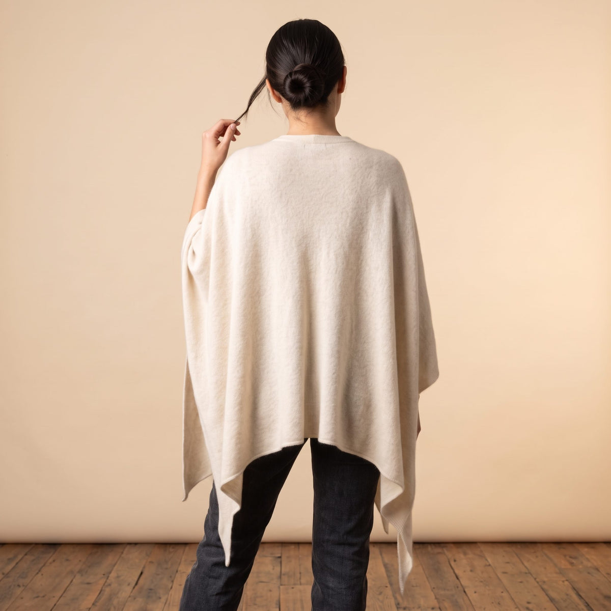 Women's V-neck cashmere poncho in Off-White — worn by a model (4)
