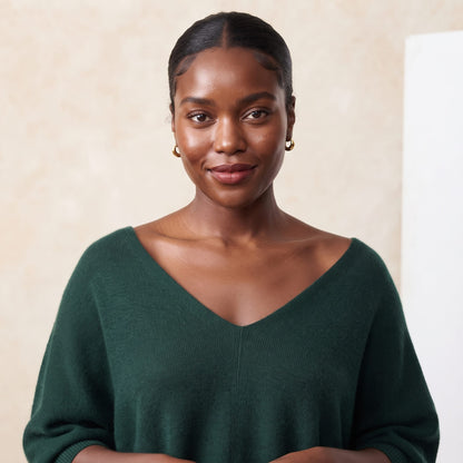 Women's V-neck cashmere poncho in Pine — worn by a model