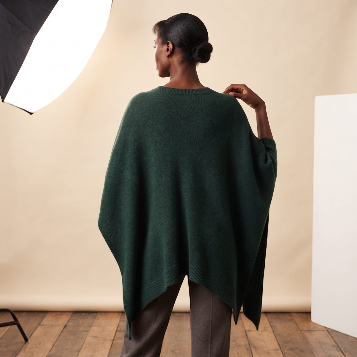 Women's V-neck cashmere poncho in Pine — worn by a model (4)