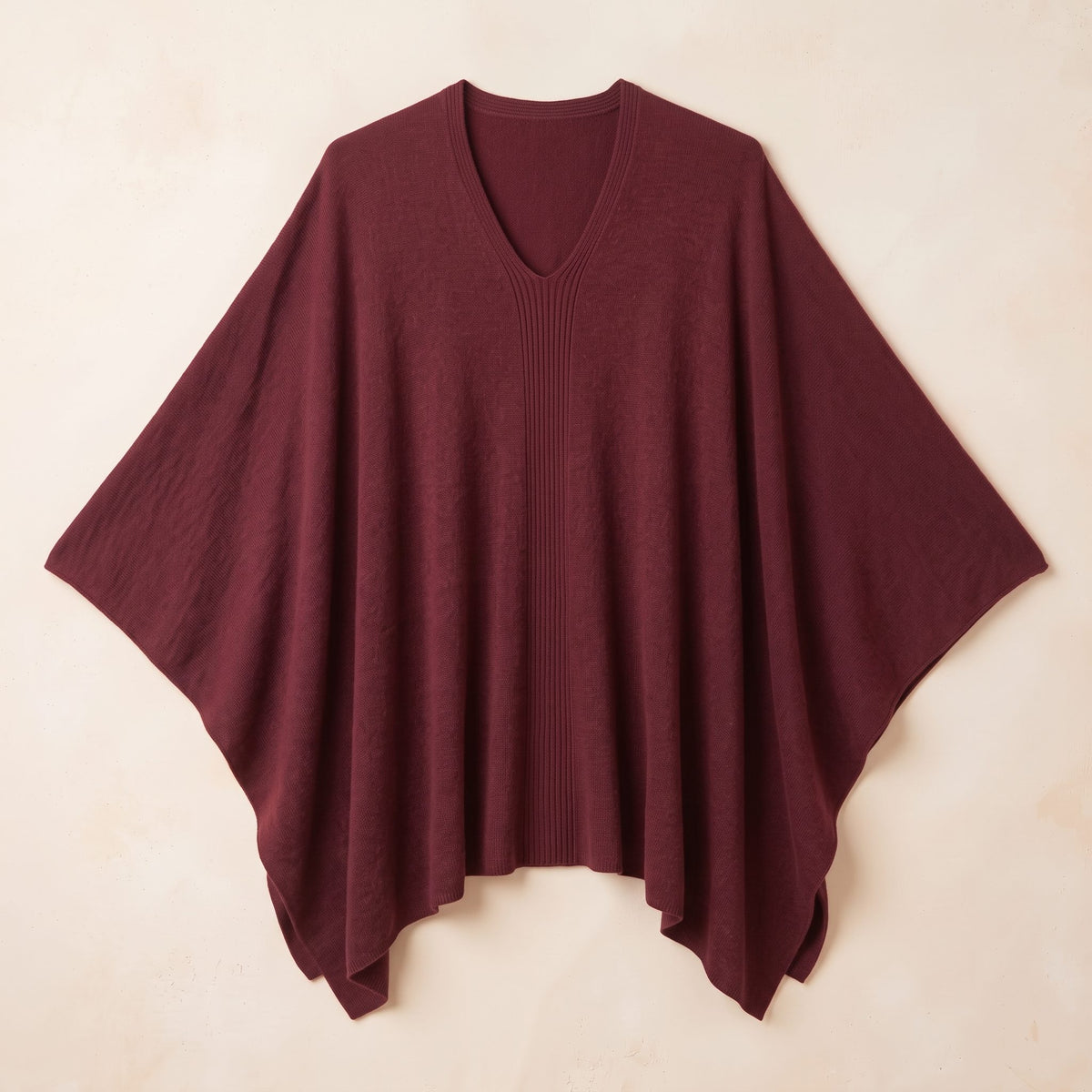 Women's V-neck cashmere poncho in Wine Red — laid flat