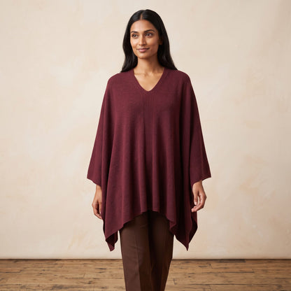 Women's V-neck cashmere poncho in Wine Red — worn by a model (2)
