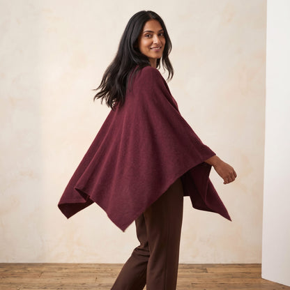 Women's V-neck cashmere poncho in Wine Red — worn by a model (3)