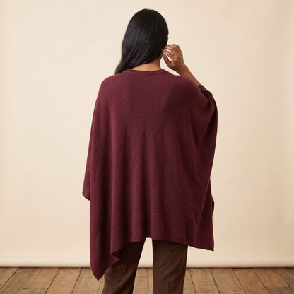 Women's V-neck cashmere poncho in Wine Red — worn by a model (4)