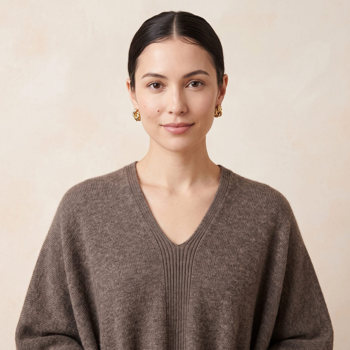 Women's undyed cashmere poncho in Toast Melange — worn by a model