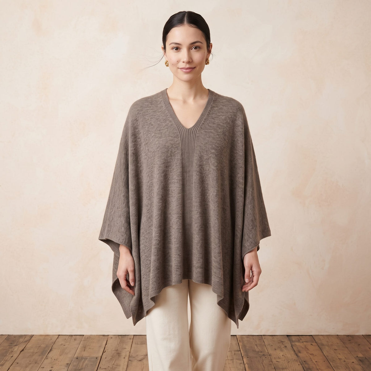 Women's undyed cashmere poncho in Toast Melange — worn by a model (2)