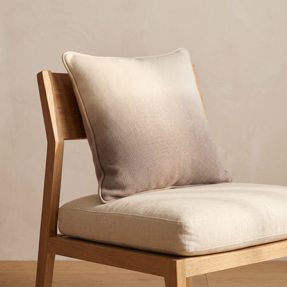 Toast Ombré 100% cashmere pillow cover, on a dining chair
