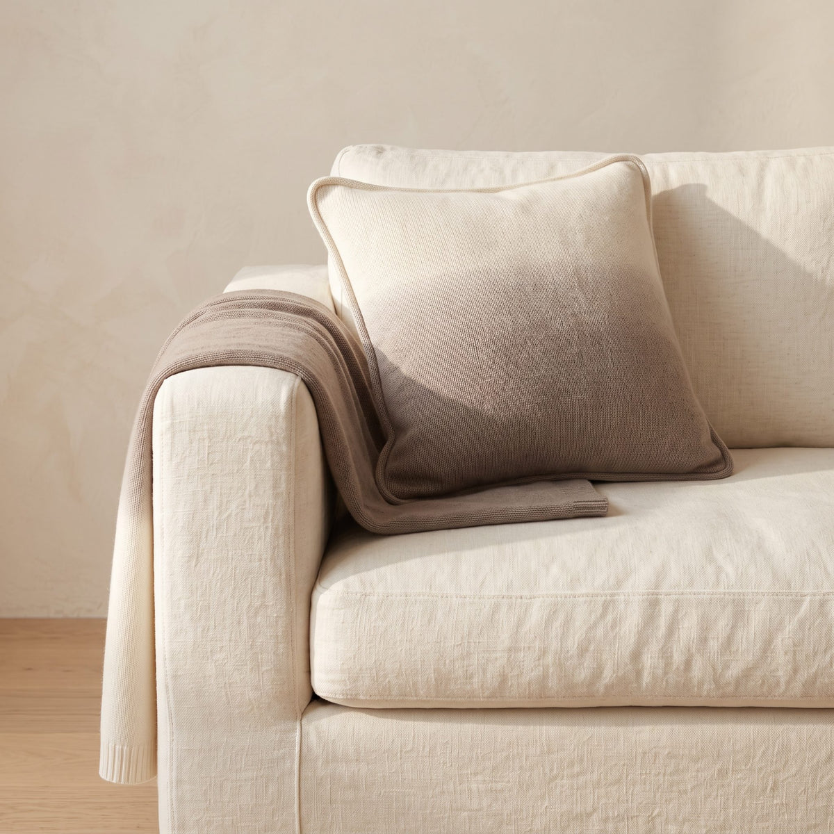 Toast Ombré 100% cashmere pillow cover, styled with the matching throw