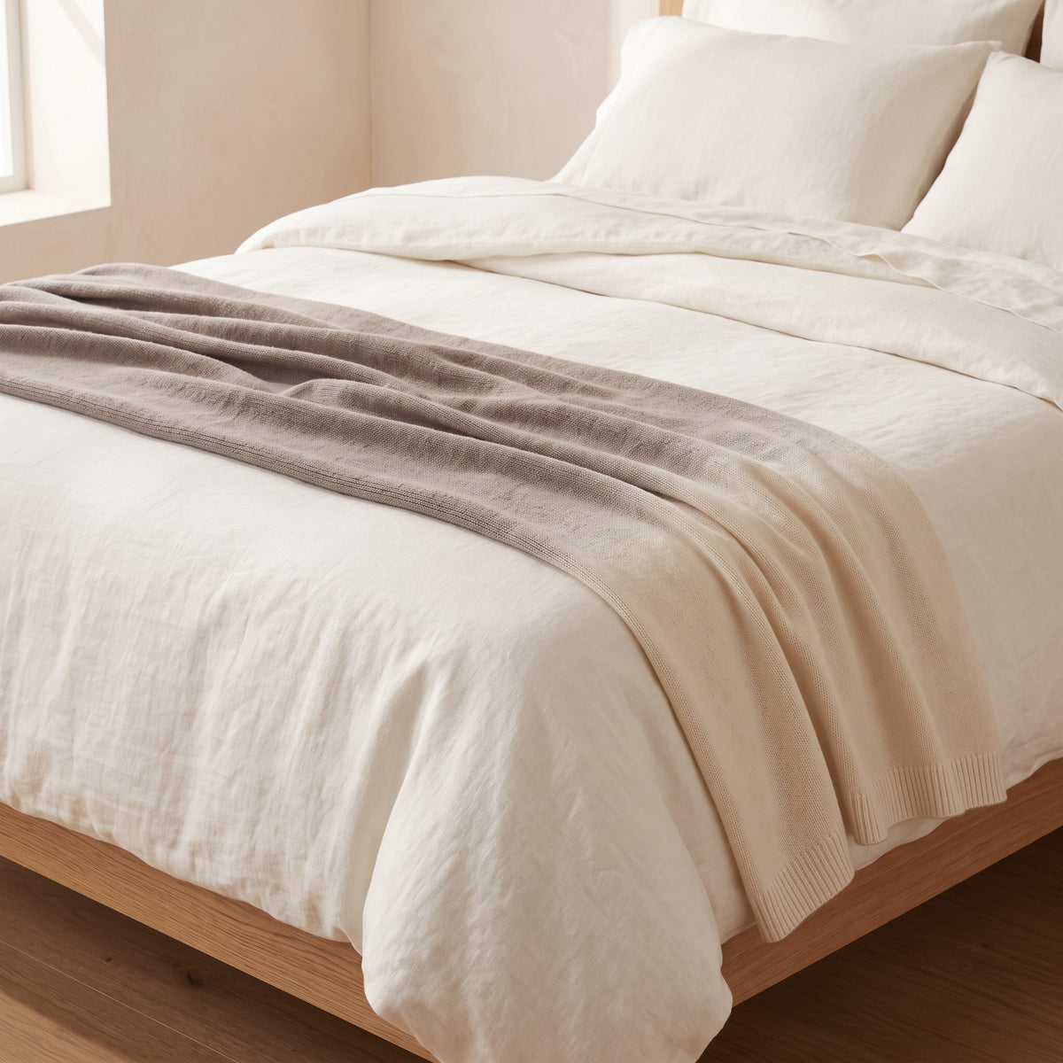 Toast Ombré 100% cashmere throw, across the foot of a bed