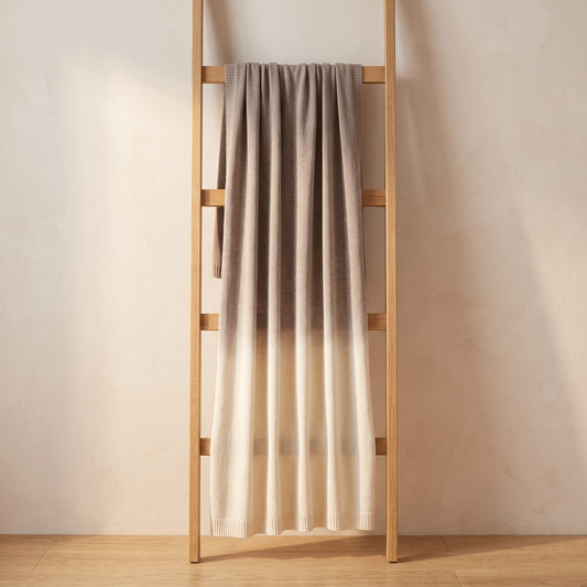 Toast Ombré 100% cashmere throw, folded over a blanket ladder